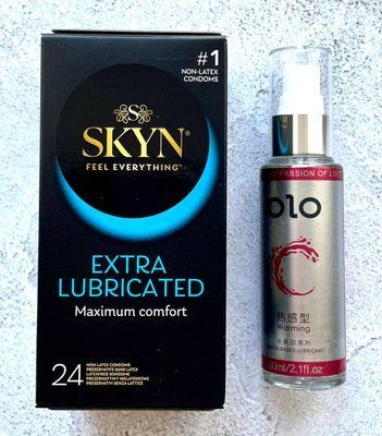 Комплект SKYN Extra Lube 24 шт + Лубрикант зігріваючий OLO 60 мл SOS2318 фото